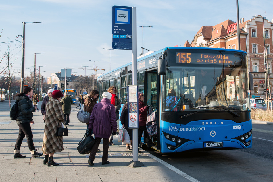 Passengers boarding a bus at a bus station